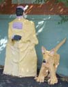 Man and dog statue.